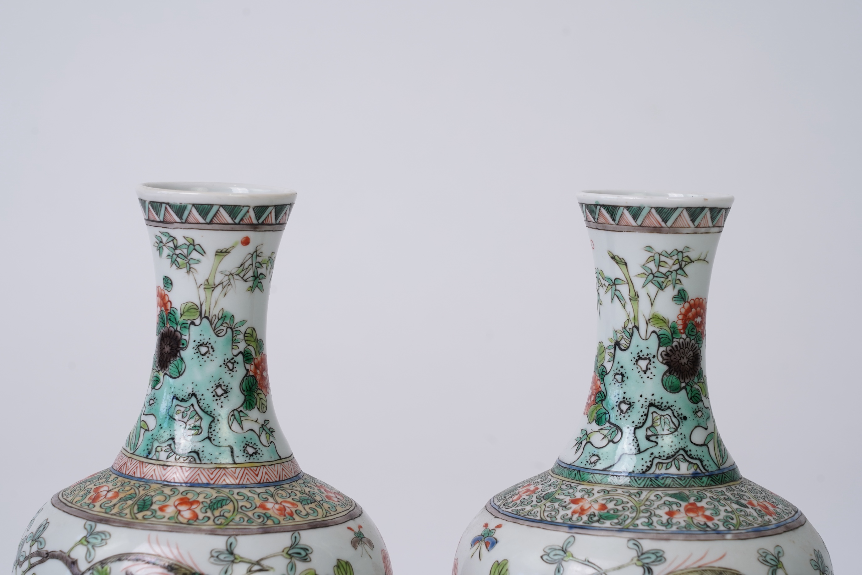 A pair of Chinese famille verte bottle vases, early 20th century